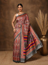 Red, brown and orange paisley and floral printed saree with a wide multi-banded striped pallu, styled with a reference blouse.