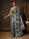 Navy blue and off-white floral printed Kashmiri Silk saree with a crackled texture and teal end-bands on the pallu.