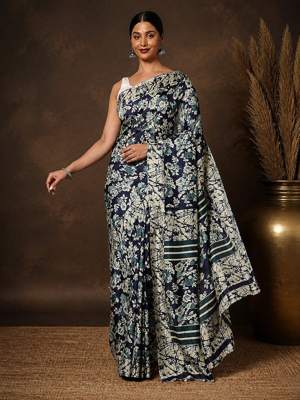 Navy blue and off-white floral printed Kashmiri Silk saree with a crackled texture and teal end-bands on the pallu.