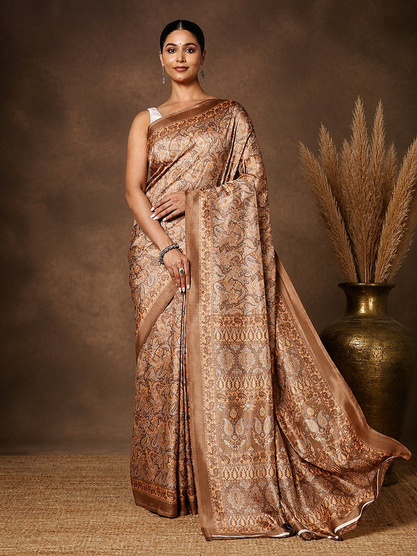 Tan and brown Kashmiri Silk printed saree with an all-over paisley and scrolling floral print and a wide vertical panelled border of repeating decorative bands.