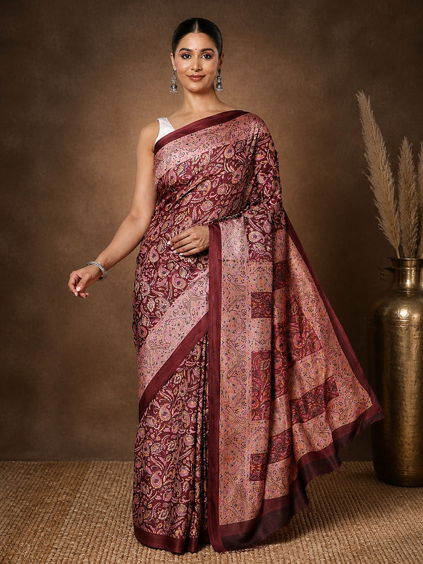 Deep maroon printed saree with panelled paisley clusters in gold and pink and a wide leaf-and-scroll border.