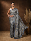 Slate grey Kashmiri Silk printed saree with a fine all-over paisley and floral print in gold, a wide ornate paisley pallu and a narrow multi-layered decorative trim.