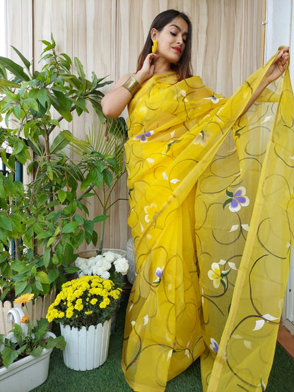 Hand Painted Organza Saree Yellow Colour with touch of gold print in vibrant Indian colours and matching running Blouse