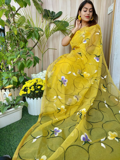 Hand Painted Organza Saree Yellow Colour with touch of gold print in vibrant Indian colours and matching running Blouse
